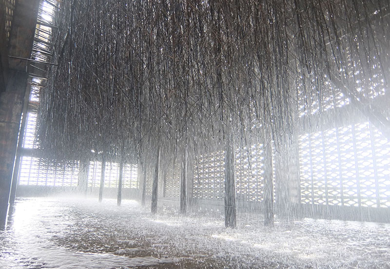 Interior of salt tower in Aguni with seawater flowing over bamboo racks and windowed walls. Interior of salt tower in Aguni with seawater flowing over bamboo racks and windowed walls.
