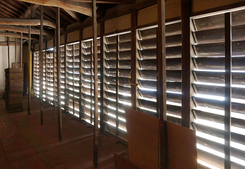 Incense sticks drying indoors with natural light and air from workshop windows aiding the process. Incense sticks drying indoors with natural light and air from workshop windows aiding the process.
