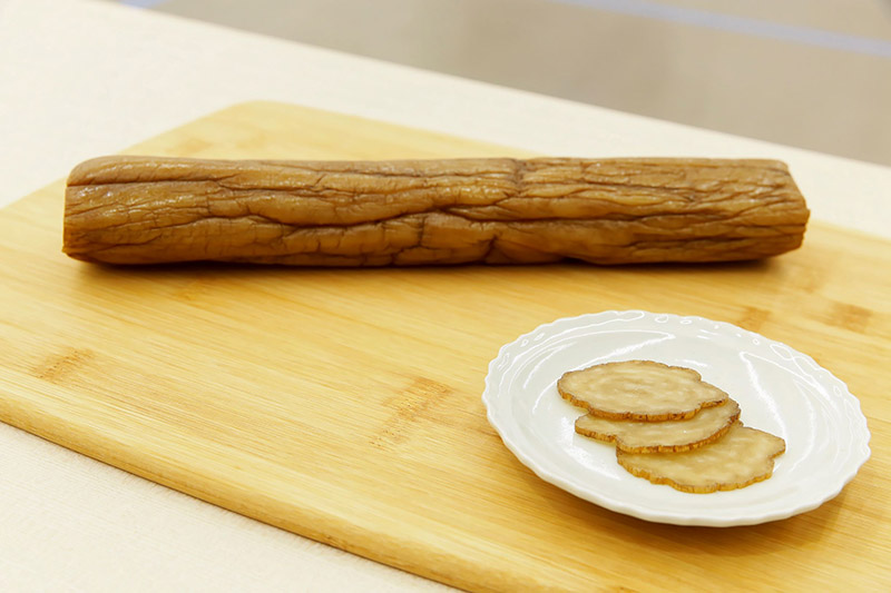 Smoked daikon radishes suspended over smoldering oak wood, prepared using a traditional method. Smoked daikon radishes suspended over smoldering oak wood, prepared using a traditional method.
