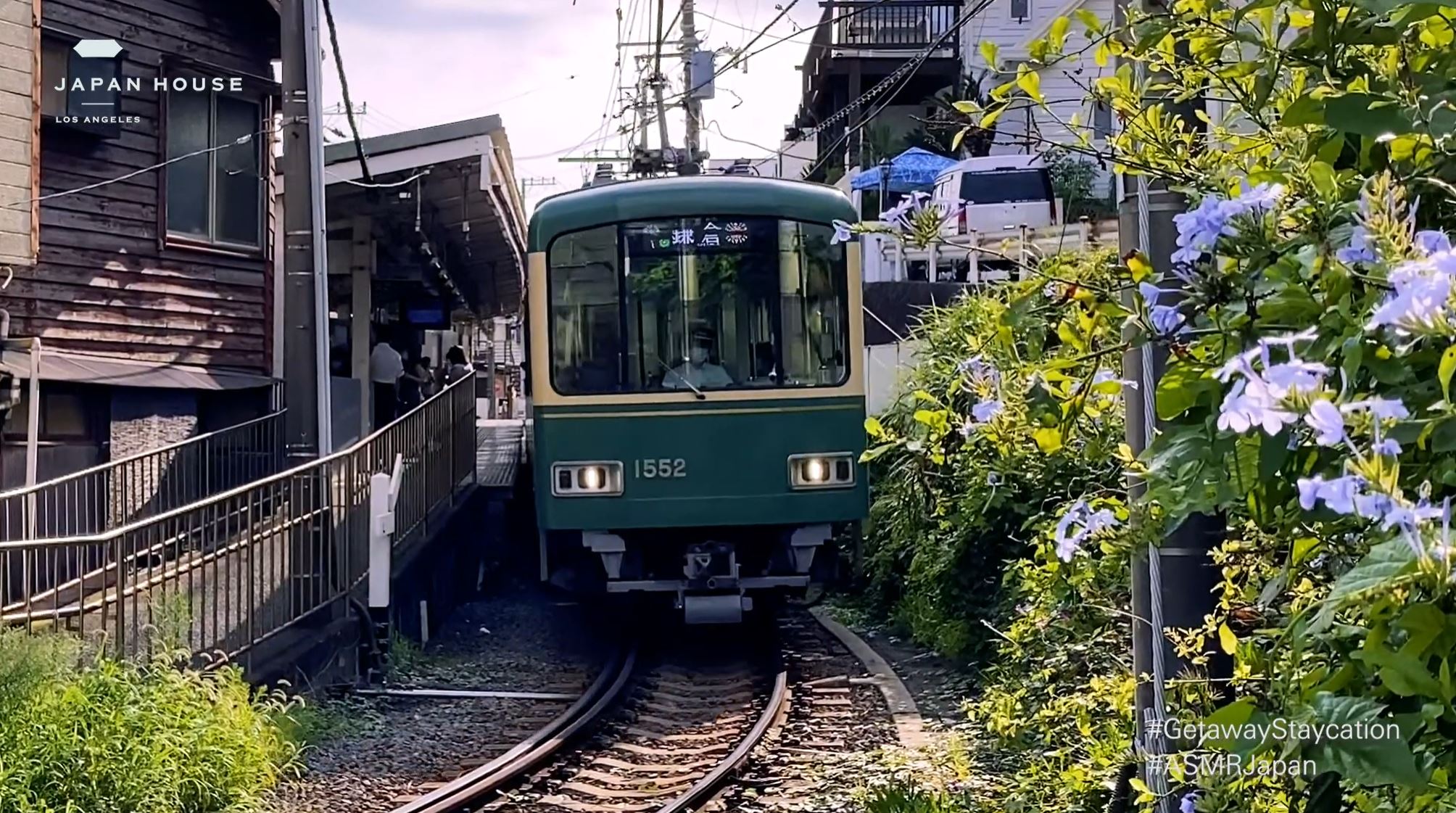Japanese train leaving a train station