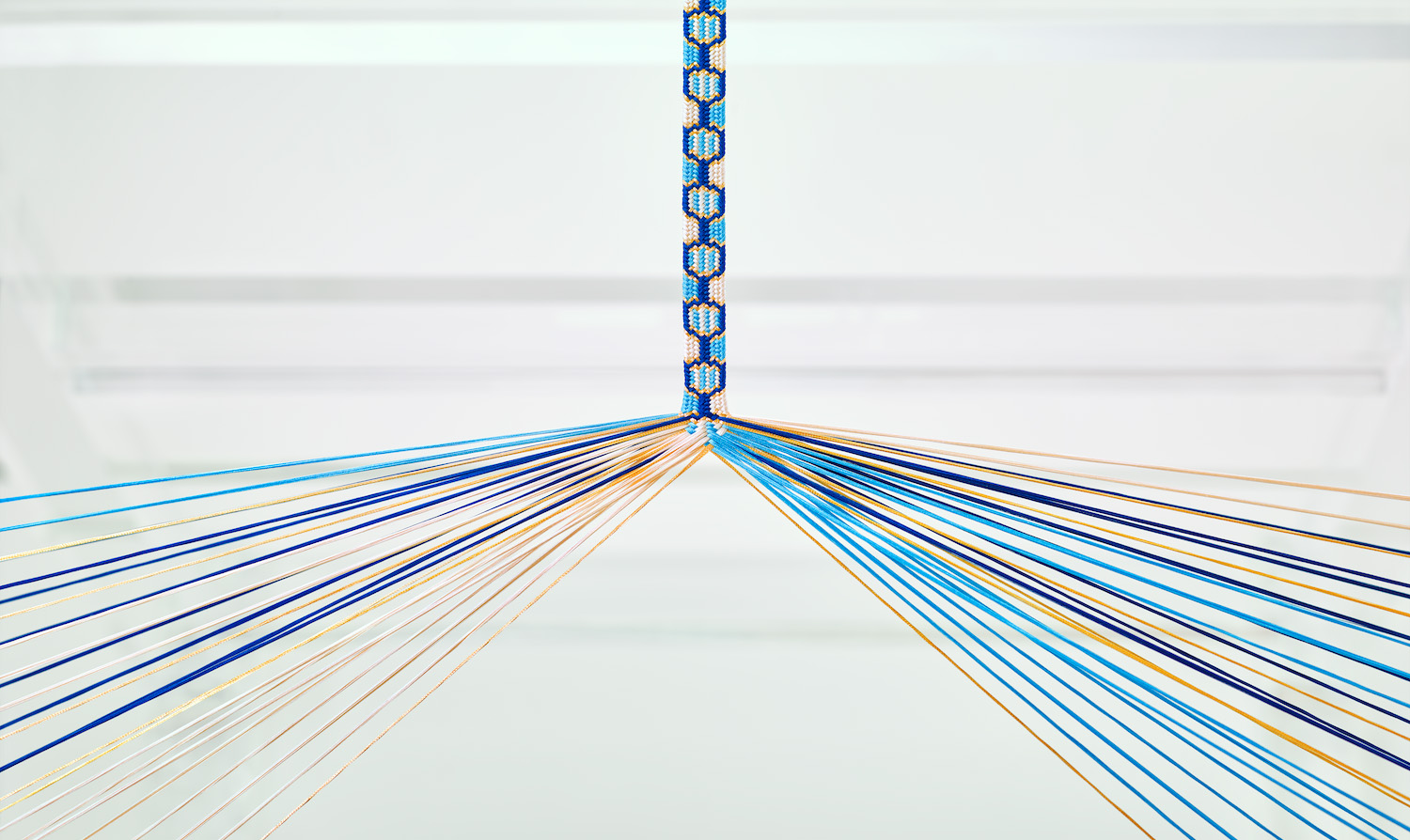 kumihimo silk braiding using blue, white and gold silk threads