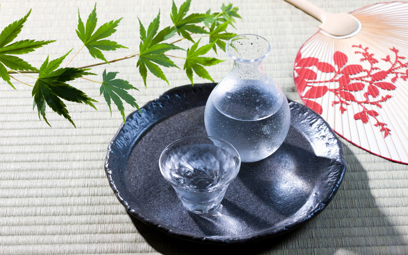 Japanese sake in clear glasses on a tray