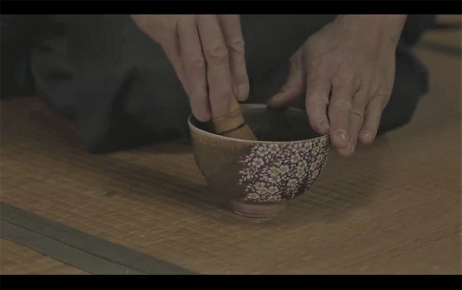 making matcha green tea in a bowl by Shibukusa Ryuzo VI