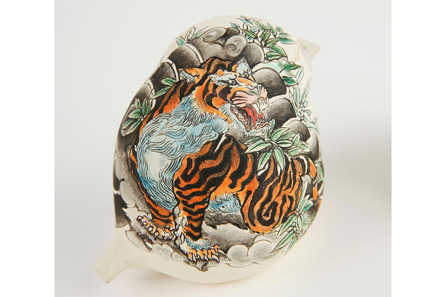 tiger drawn on a ceramic bird