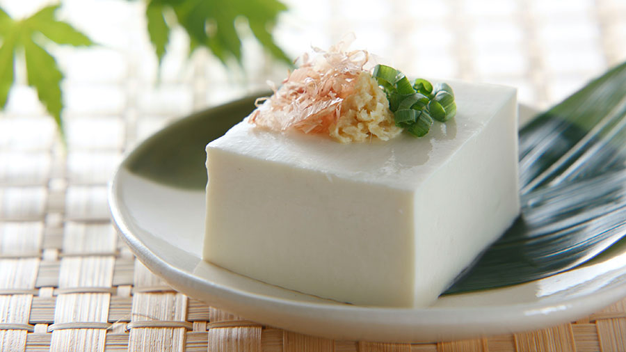 Chilled tofu topped with green onion and bonito flake