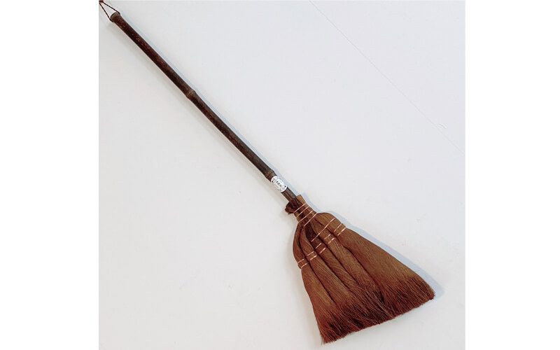 A broom made using black bamboo