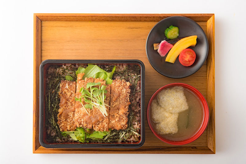 Vegan cutlet, side dishes and miso soup on a tray