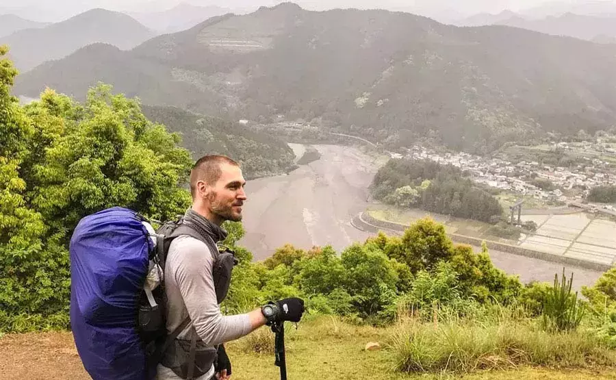 Craig Mod walking in the mountains in Japan