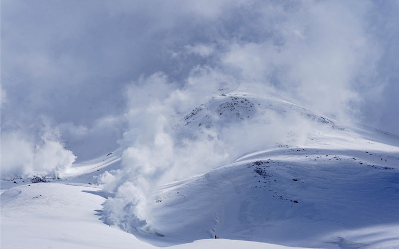 Another view of snow-covered mountains in Hokkaido with layers of frosted peaks.