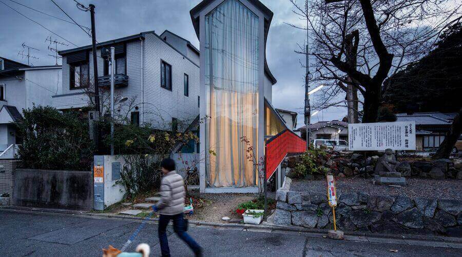 O House by Hideyuki Nakayama Architecture in a Japanese neighborhood with person and dog. 